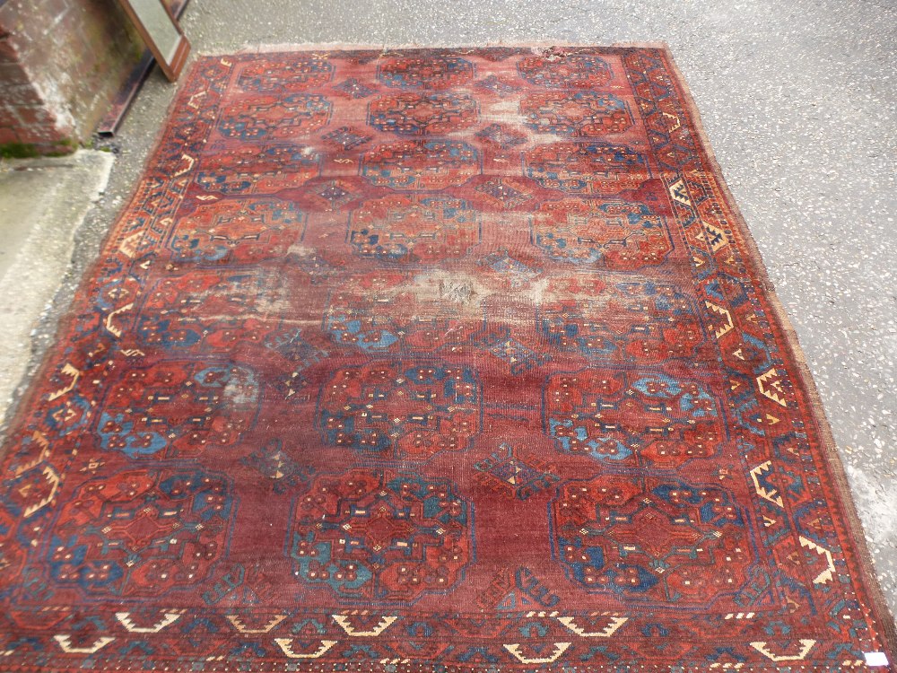 An Afghan rug, having three rows of medallions and one other Caucasian rug, the largest 248 x 208cms
