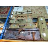 Six vintage suitcases of various sizes, to include military styles