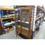 A reproduction glass dish cabinet over two drawers and two doors and Mahogany inlaid glazed