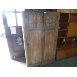 Limed oak gentlemans wardrobe with carved doors