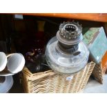 Wicker basket containing brass oil lamps etc.