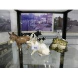 Shelf of mainly Beswick model animals incl. pig, cat, cows etc. and a small crystal decanter