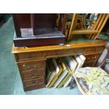 Mahogany pedastal desk with green tooled leather top above 9 drawers