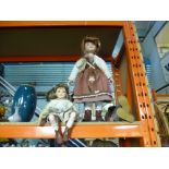 Three china headed dolls, two girls and a boy