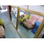 Pair of large gilt framed bevelled wall mirrors