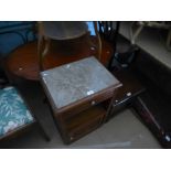 Oak bedside cabinet with marble top above drawer and cupboard and small sewing stool
