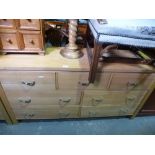 Contemporary oak sideboard with 3 short drawers above 4 long