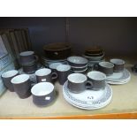A quantity of brown and cream pottery to include cups, plates and a quantity of Royal Albert and