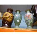 Two decorative green vases with painted flowers and a glazed larger brown vase