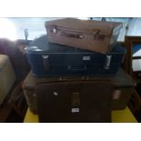 Two vintage suitcases and a leather satchel