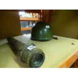A vintage military helmet and a vintage telescope marked OS822GA No. 41 MkII, 1943