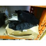 Box of vintage clothing including a black velvet coat etc.