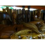 A small selection of carved treen to include tribal figures, animals, etc.