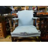 A Reproduction mahogany Gainsborough armchair on square moulded legs