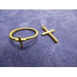 Yellow metal ring and cross pendant