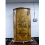 A late 18/ early 19th Century painted bow fronted corner cupboard probably Dutch, showing its