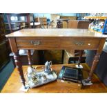 Victorian mahogany side table with two drawers on turned supports and castors