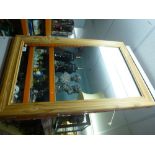 A large pine framed mirror