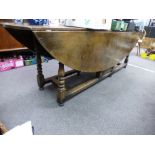 A good Reproduction oak two flap Hunt table, on turned legs, length 245cms