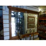 A large pine mirror and a small pine bookcase