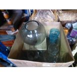 Box of drinking glasses and glass vase on wooden plinth