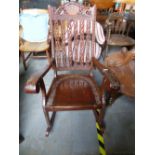 Mahogany carved rocking armchair