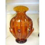 A mid 20th century orange glass vase with ribbed decoration, 29cms