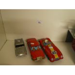 Two vintage tin cars - one a Red Hawk sports car, family saloon and a plastic 007 Aston Martin car