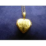 9ct yellow gold neck chain and heart shaped locket, both stamped 375, total weight 4.1g