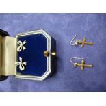 Pair of 9ct earrings in the form of bows and a pair of 9ct yellow gold cross drop earrings