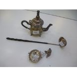 A white metal. possibly Morocan, coffee pot, accompanied with a damaged tea strainer and punch level