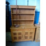 Vintage teak dresser with open rack above drawers and cupboards