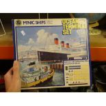 Two boxed Minic ships sets and a Chad Valley globe