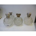 Two pairs of cut glass scent bottles, with silver tops AF, hallmarked Birmingham 1907 and 1892