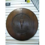 A mahogany circular table top, the centre having carving of Footballer Duggie Reid, Pompey -