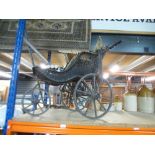 A Victorian Wicker pram on a steel frame