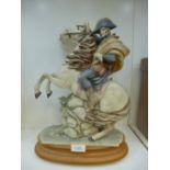 A Capodimonte figure of Napoleon on horseback, signed Redaelli