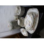 A quantity of Continental dinnerware, decorated flowers, probably German