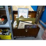 A large wooden trunk with brass handles