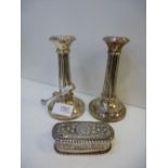 A pair of silver hallmarked candle sticks, Birmingham 1922 - height 5 1/2 inches. A silver