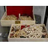 Cream jewellery box containing costume jewellery, pear neckless, bangles, tiger brooch, earrings,