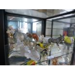 A small selection of animals ornaments to include a donkey and a cow by Lladro, donkey by Goebel
