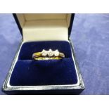 18ct yellow gold ring set with 3 diamonds, size O, marked total item weight approx 3.4g