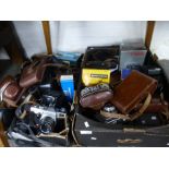 2 crates of vintage cameras etc to include Olympus, Praktica, Konica, Braun etc.