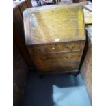 Vintage oak writing bureau with fitted interior above 3 drawers on bracket feet
