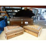 A dark wood jewellery box having mother of pearl inlay along with two smaller carved boxes