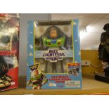 A boxed Buzz Lightyear Action figure with a boxed Space Warrior, the walking robot