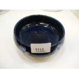 Navy with white flowers, ground circular dish by Moorcroft, AF hairline crack