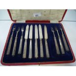 A cased box of hallmarked silver handled fish knives and forks - one knife missing, in A/F condition