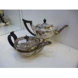 A silver tea pot and another, both hallmarked, one London 1906, maker DW JW - Daniel and John